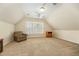 Large bonus room with carpet and window offers a versatile living space at 2545 Churchill Dr, Burlington, NC 27215