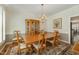 Formal dining room with wood table, chairs, chandelier, and china cabinet, perfect for gatherings at 2545 Churchill Dr, Burlington, NC 27215