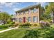 Well-maintained brick house with a manicured lawn and vibrant azaleas in the front yard at 2545 Churchill Dr, Burlington, NC 27215