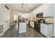 Bright kitchen features white cabinets, granite countertops, stainless steel appliances and tile flooring at 2545 Churchill Dr, Burlington, NC 27215