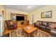 Comfortable living room featuring hardwood floors, a fireplace, and a large entertainment center at 2545 Churchill Dr, Burlington, NC 27215