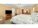 Comfortable main bedroom featuring a floral-patterned bedspread, soft lighting, and an inviting atmosphere at 2545 Churchill Dr, Burlington, NC 27215