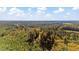 Vast aerial perspective of property, displaying the rich, forested landscape and a clear view of the skyline at 2605 Joe Pruitt Rd, Oxford, NC 27565