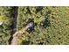 Overhead view of the property shows it's privacy within a secluded location surrounded by a dense canopy of trees at 2605 Joe Pruitt Rd, Oxford, NC 27565