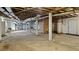 Large unfinished basement with concrete floors, exposed utilities, and a walk-out door at 2605 Joe Pruitt Rd, Oxford, NC 27565