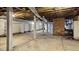 An unfinished basement featuring concrete floors, brick accents and exposed utilities at 2605 Joe Pruitt Rd, Oxford, NC 27565