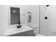 Modern bathroom features a sleek vanity, marble shower, and black hardware at 2605 Joe Pruitt Rd, Oxford, NC 27565