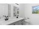 A beautifully renovated bathroom with double sinks, modern fixtures, and plenty of counter space at 2605 Joe Pruitt Rd, Oxford, NC 27565