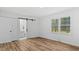 Bright bedroom with a modern sliding closet door, wood-look flooring and natural light at 2605 Joe Pruitt Rd, Oxford, NC 27565