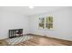 Inviting bedroom with wood-look flooring and desk space with chair at 2605 Joe Pruitt Rd, Oxford, NC 27565