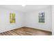 Bright bedroom with two windows offering natural light and wood-look flooring at 2605 Joe Pruitt Rd, Oxford, NC 27565