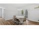 Cozy dining area featuring hardwood floors and access to a back deck at 2605 Joe Pruitt Rd, Oxford, NC 27565