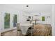 Open dining space with modern lighting and a seamless flow to the outdoor area at 2605 Joe Pruitt Rd, Oxford, NC 27565