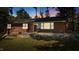 Charming brick home with a classic black door, white trim, and lush green lawn at 2605 Joe Pruitt Rd, Oxford, NC 27565