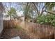 Fenced-in backyard space with plenty of mature trees at 305 Freeman St, Raleigh, NC 27601