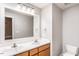 Bright bathroom with double vanity, modern lighting, and large mirror at 305 Freeman St, Raleigh, NC 27601