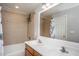 Bright bathroom featuring a double sink vanity and a tiled shower-over-tub at 305 Freeman St, Raleigh, NC 27601