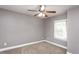 Bedroom featuring neutral walls, carpet, ceiling fan, and a window at 305 Freeman St, Raleigh, NC 27601