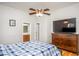 This bedroom has a dresser with a TV on it and a door to the bathroom at 305 Freeman St, Raleigh, NC 27601