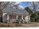 Charming house with a welcoming front porch and mature trees in a quiet neighborhood at 305 Freeman St, Raleigh, NC 27601