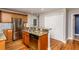 Modern kitchen showcasing stainless steel appliances, granite countertops, and wood cabinets at 305 Freeman St, Raleigh, NC 27601