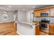 Modern kitchen featuring stainless steel appliances, granite countertops, and hardwood floors at 305 Freeman St, Raleigh, NC 27601