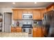 A well-equipped kitchen featuring stainless steel appliances and ample cabinet space for storage at 305 Freeman St, Raleigh, NC 27601