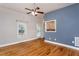 Inviting living room with hardwood floors, neutral walls, and an abundance of natural light at 305 Freeman St, Raleigh, NC 27601