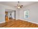 Cozy living room with hardwood floors, neutral walls, and an open layout connecting to the kitchen at 305 Freeman St, Raleigh, NC 27601