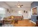 Bright living room with hardwood floors, large windows, and stylish decor at 305 Freeman St, Raleigh, NC 27601