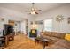 Bright and airy living room featuring hardwood floors and an open layout to the kitchen at 305 Freeman St, Raleigh, NC 27601