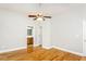 Main bedroom features hardwood floors, ceiling fan, and ensuite bathroom at 305 Freeman St, Raleigh, NC 27601
