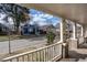 View from the covered front porch looking out onto a peaceful residential street and neighboring homes at 305 Freeman St, Raleigh, NC 27601