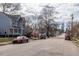Picturesque street view showcasing a mix of architectural styles and mature trees in a vibrant neighborhood at 305 Freeman St, Raleigh, NC 27601