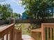Fenced backyard featuring a garden and steps leading to a concrete patio at 314 Gray Ave, Durham, NC 27701