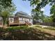 Backyard featuring a wooden deck, small garden area, and a wood fence at 314 Gray Ave, Durham, NC 27701