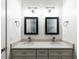 Bathroom vanity with double sinks, granite countertop, modern fixtures, and framed mirrors at 314 Gray Ave, Durham, NC 27701