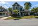 Charming two-story home with gray siding, white trim, covered porch, and mature trees at 314 Gray Ave, Durham, NC 27701