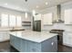 Modern kitchen featuring stainless steel appliances, a large island and white subway tile backsplash at 314 Gray Ave, Durham, NC 27701