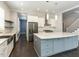 Modern kitchen with stainless steel appliances, quartz counters, and spacious center island at 314 Gray Ave, Durham, NC 27701