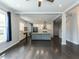 Open living area with modern kitchen, dark wood floors, and lots of natural light is perfect at 314 Gray Ave, Durham, NC 27701