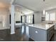 Open-concept living room with fireplace, dark wood floors, and modern decor creates inviting gathering space at 314 Gray Ave, Durham, NC 27701