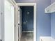 Mudroom featuring built-in shelving, tiled floor, and access to the rear exterior at 314 Gray Ave, Durham, NC 27701