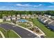 An aerial view shows the neighborhood amenities including a pool, clubhouse, playground, and parking at 338 Apricot Sun Way # 1196D, Zebulon, NC 27597