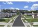 A view of a community with sidewalks, lawns and trees at 338 Apricot Sun Way # 1196D, Zebulon, NC 27597