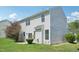 Inviting backyard showcasing lush green grass, mature trees and the home's exterior at 3604 Rivermist Dr, Raleigh, NC 27610