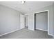 Bedroom featuring neutral walls, plush carpeting, and an open closet space at 3604 Rivermist Dr, Raleigh, NC 27610