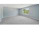 Spacious bedroom with carpet and a window showing the outdoors at 3604 Rivermist Dr, Raleigh, NC 27610