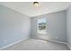 Cozy bedroom with a plush carpet and a window view of the neighborhood at 3604 Rivermist Dr, Raleigh, NC 27610