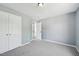 Spacious bedroom featuring neutral walls, plush carpeting, and a large closet space at 3604 Rivermist Dr, Raleigh, NC 27610